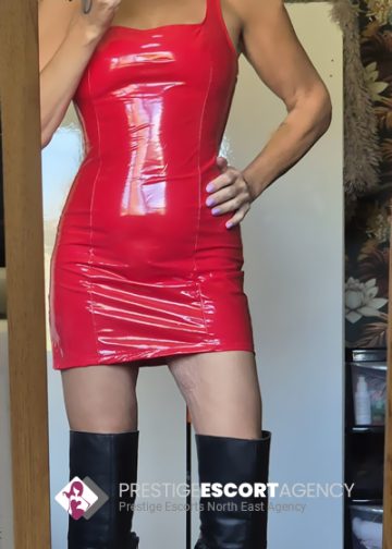 Person in red dress and black boots