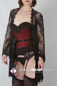 Woman in lingerie with lace robe.